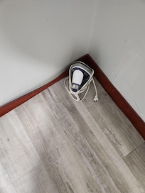 No closet, but if you want to iron, here is iron sitting on floor