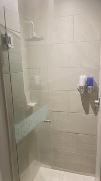 Shower with soap and shampoo provided