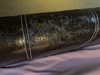 Worn out faux leather bed