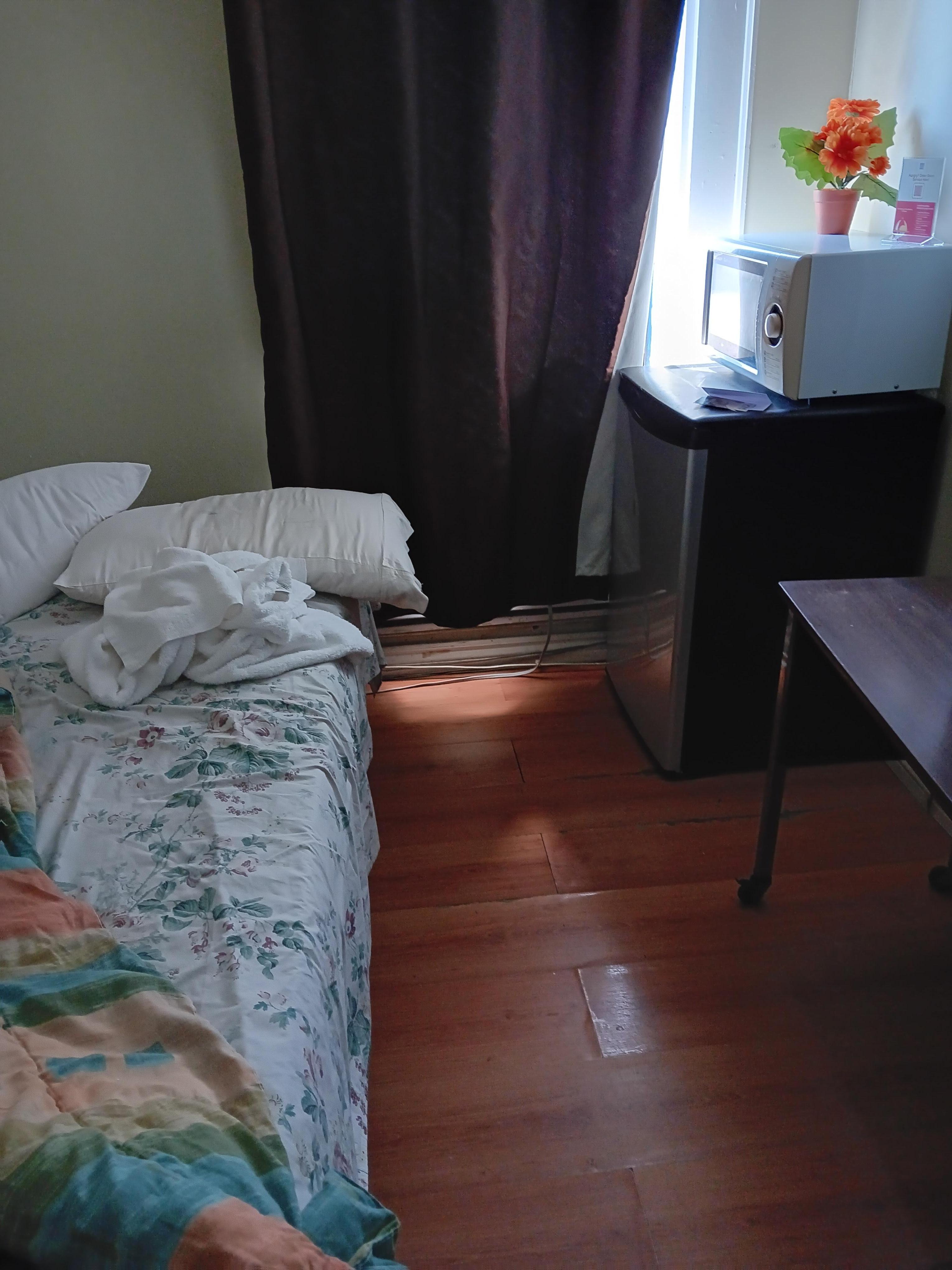 Modest but clean & cozy room furnished with fridge & microwave