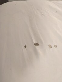 Cigarette burn holes in sheets