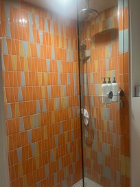 Cute colorful updated bath. Great shower!