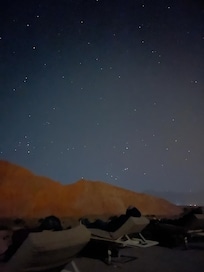 Stars appear as if you can reach with your arm.
Hotel property has star observatary deck with telescope