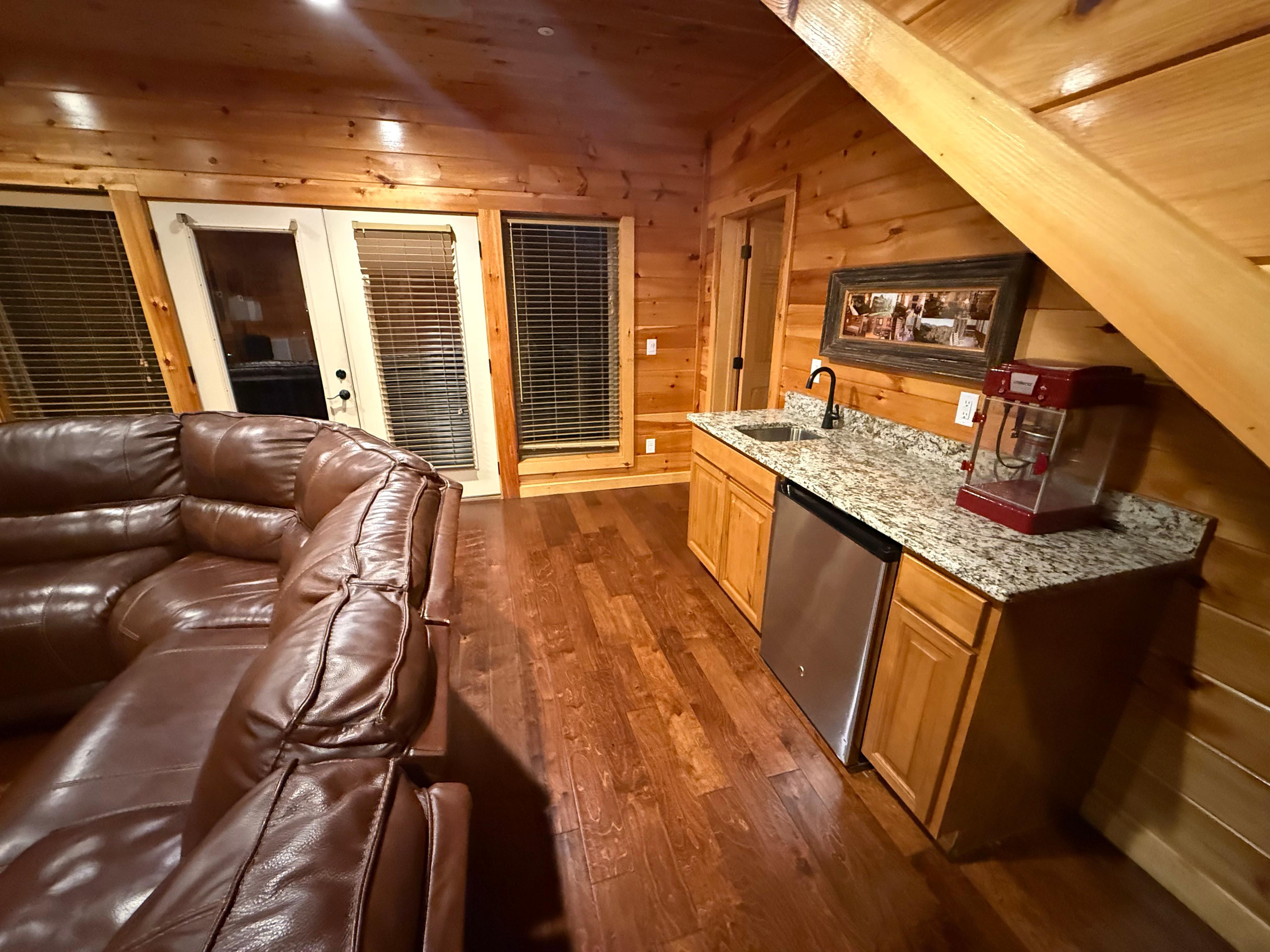 Lower level theatre room and mini kitchen  