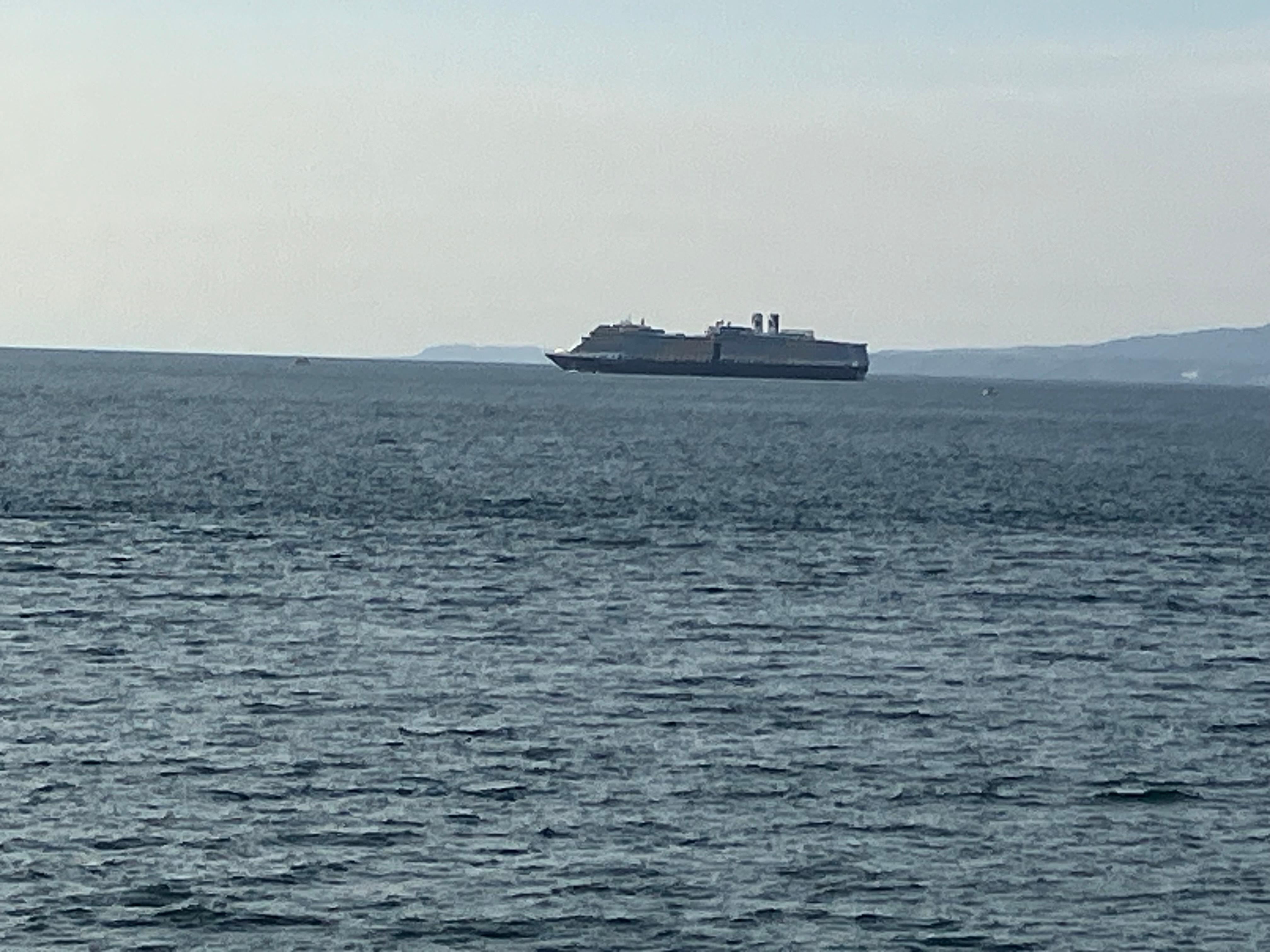 Cruise ship coming into port, seen from one of the balconies