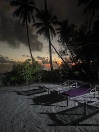 Sunrise and the lounge chairs for an afternoon rest. Every morning, the sand was raked out like a Zen garden!