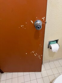 Scuffed bathroom door