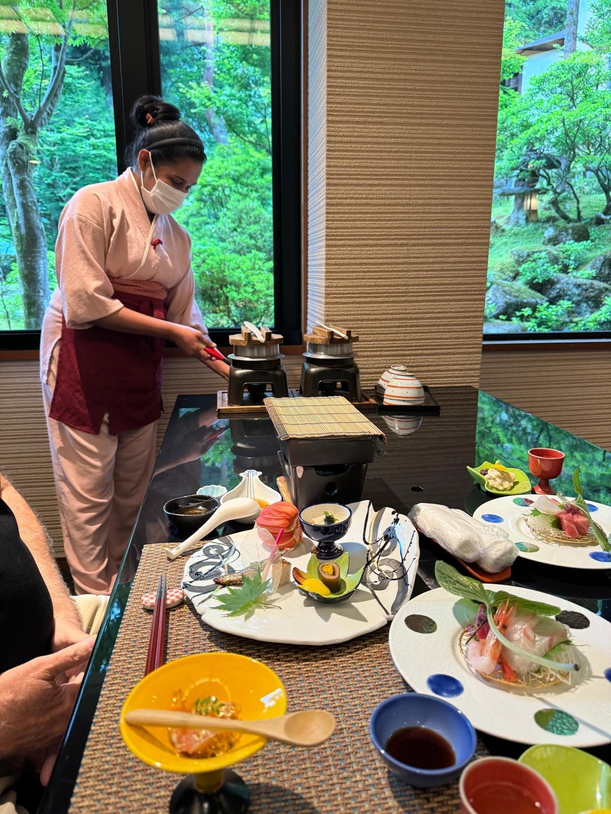 Server preparing rice dish at dinner
