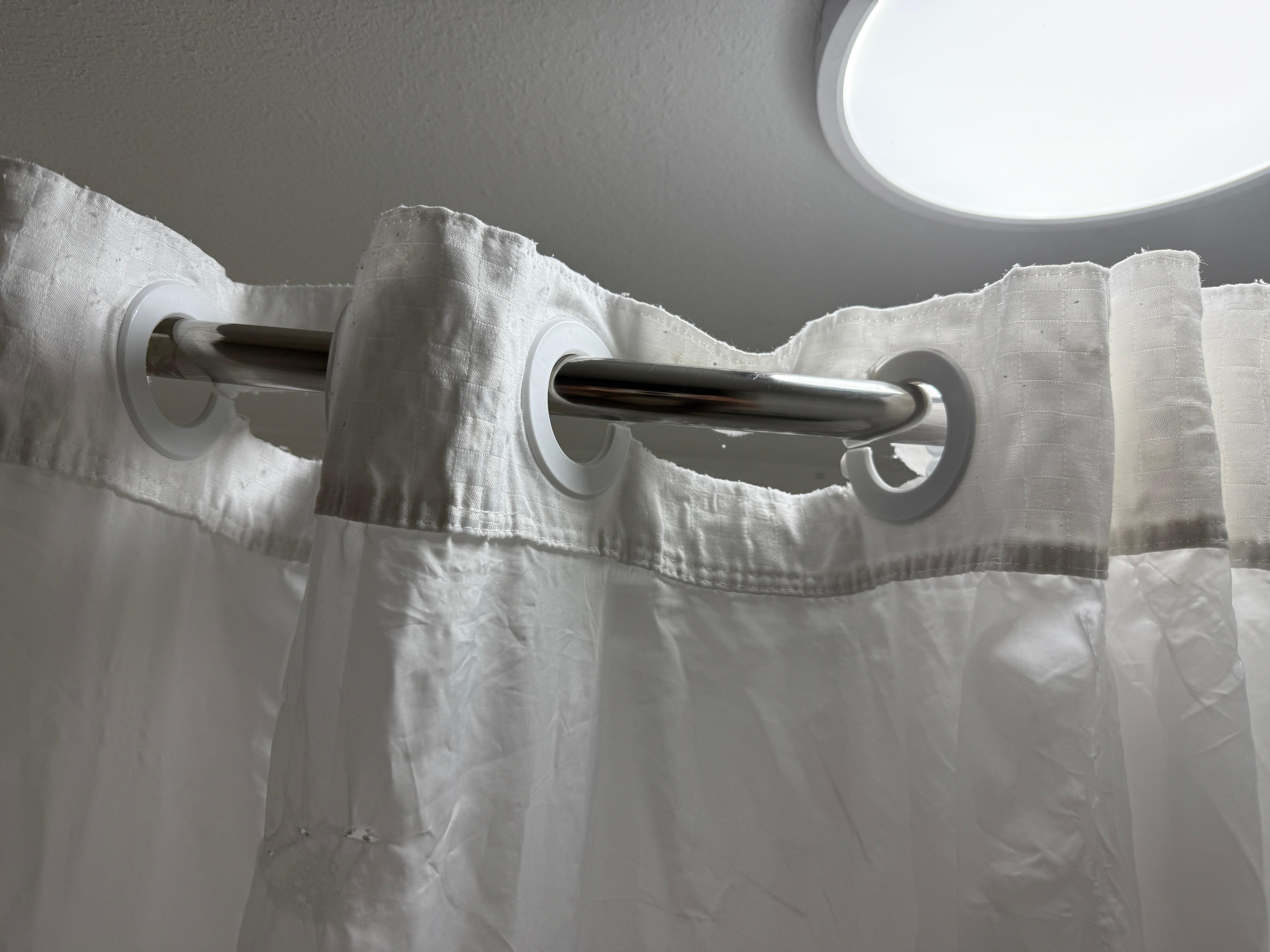 Torn shower curtain with holes 