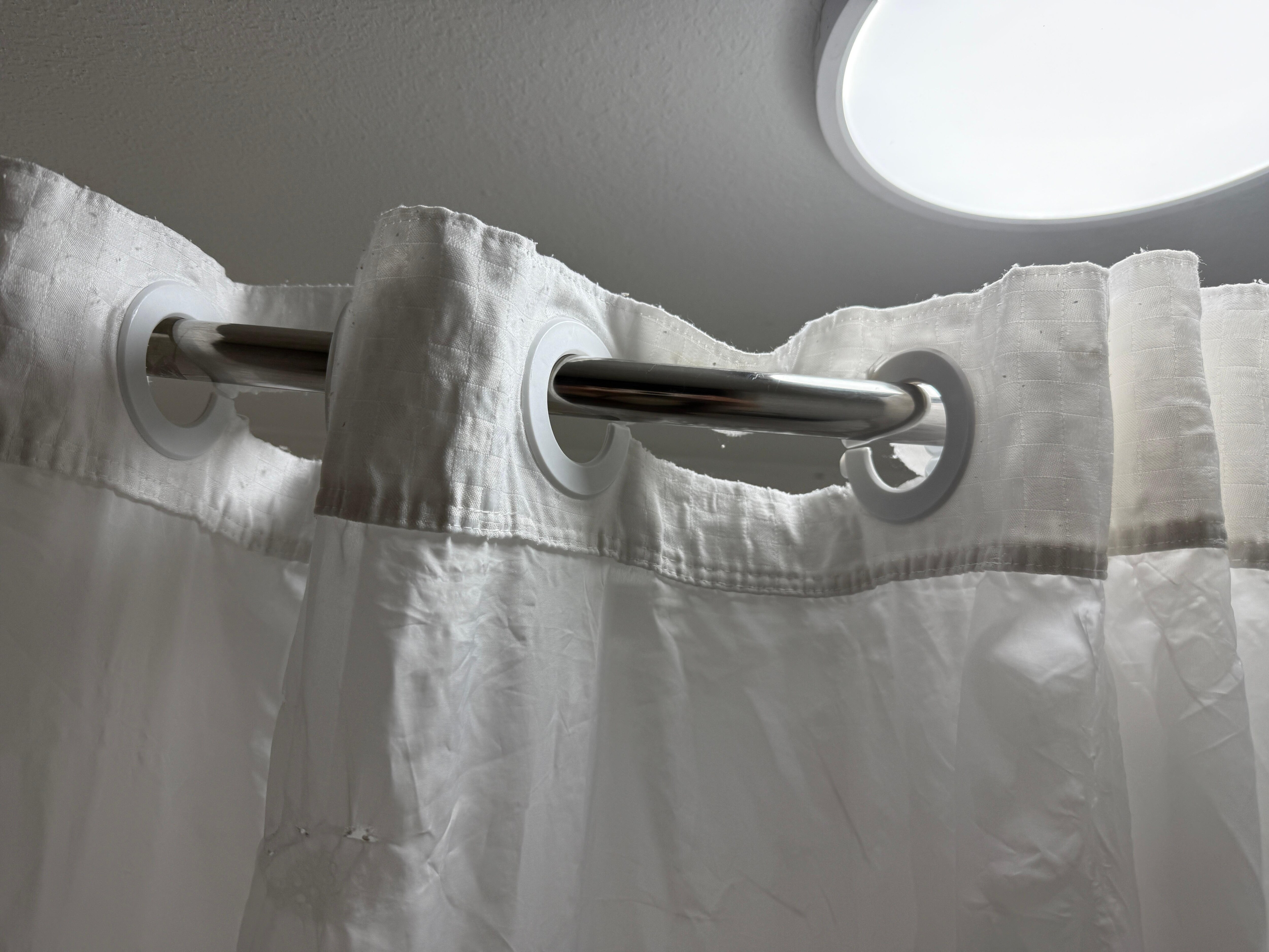 Torn shower curtain with holes 