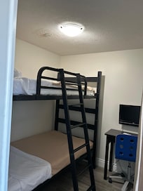 Separate “bedroom” with bunk beds. Clean