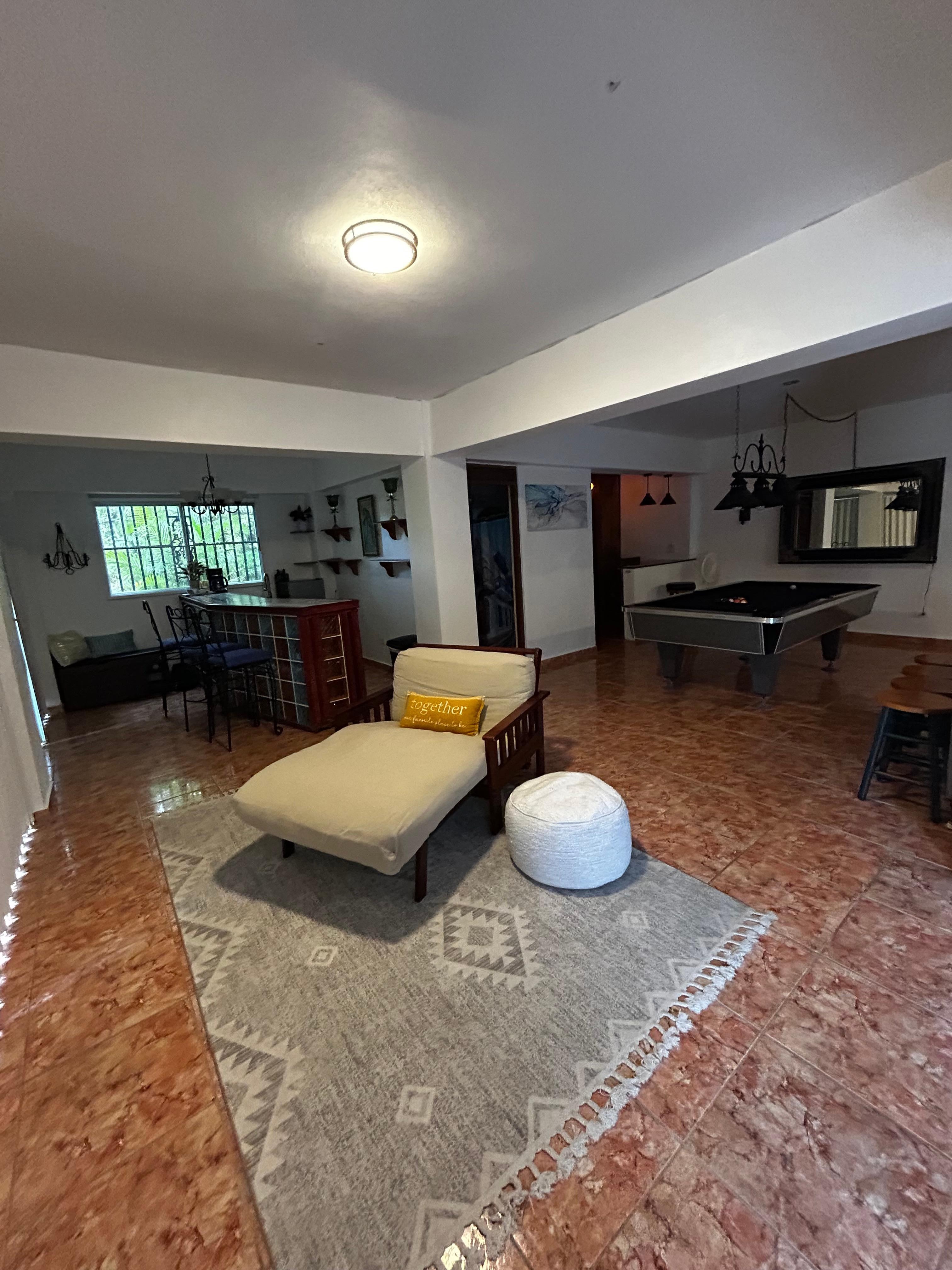 Lower level sauna, bar and pool table area.