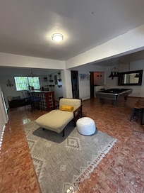 Lower level sauna, bar and pool table area.