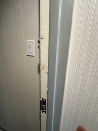 The door frame had layers of paint that were peeling each time the door was used.