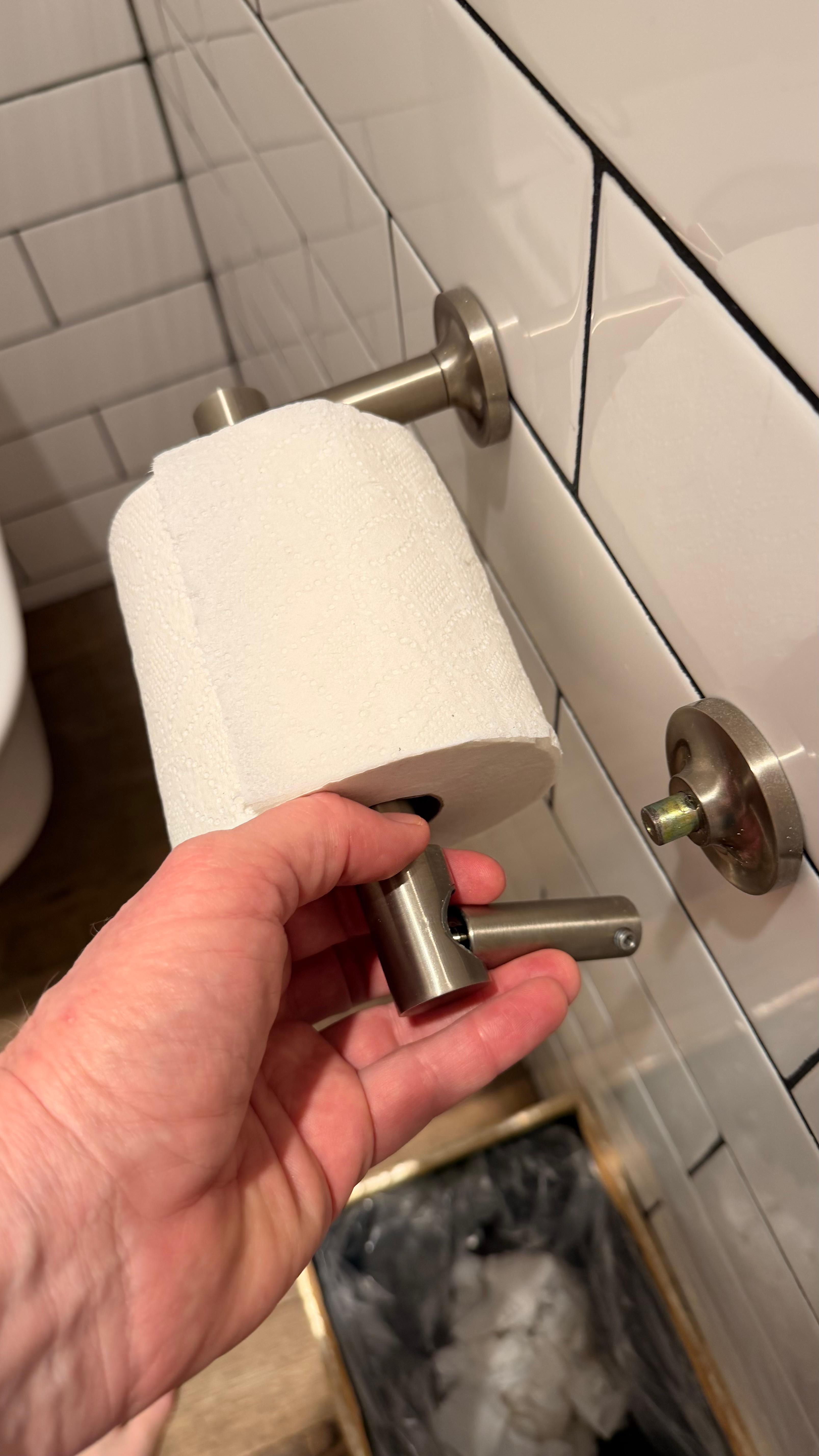 Toilet paper roll kept falling off into the garbage because the holder is broken