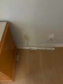 Missing blinds shoved behind the tv