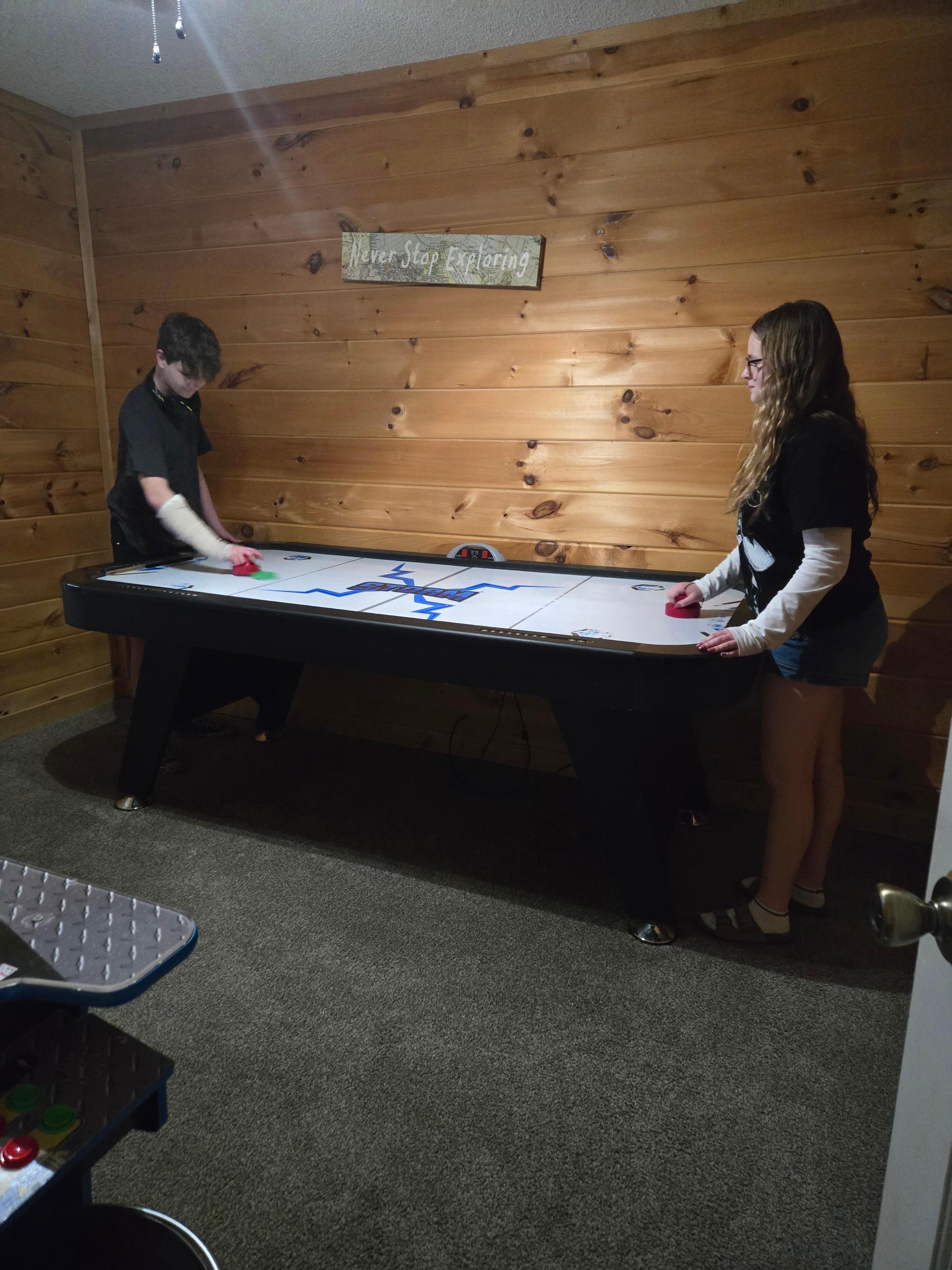 Air hockey table was the first stop for the kids