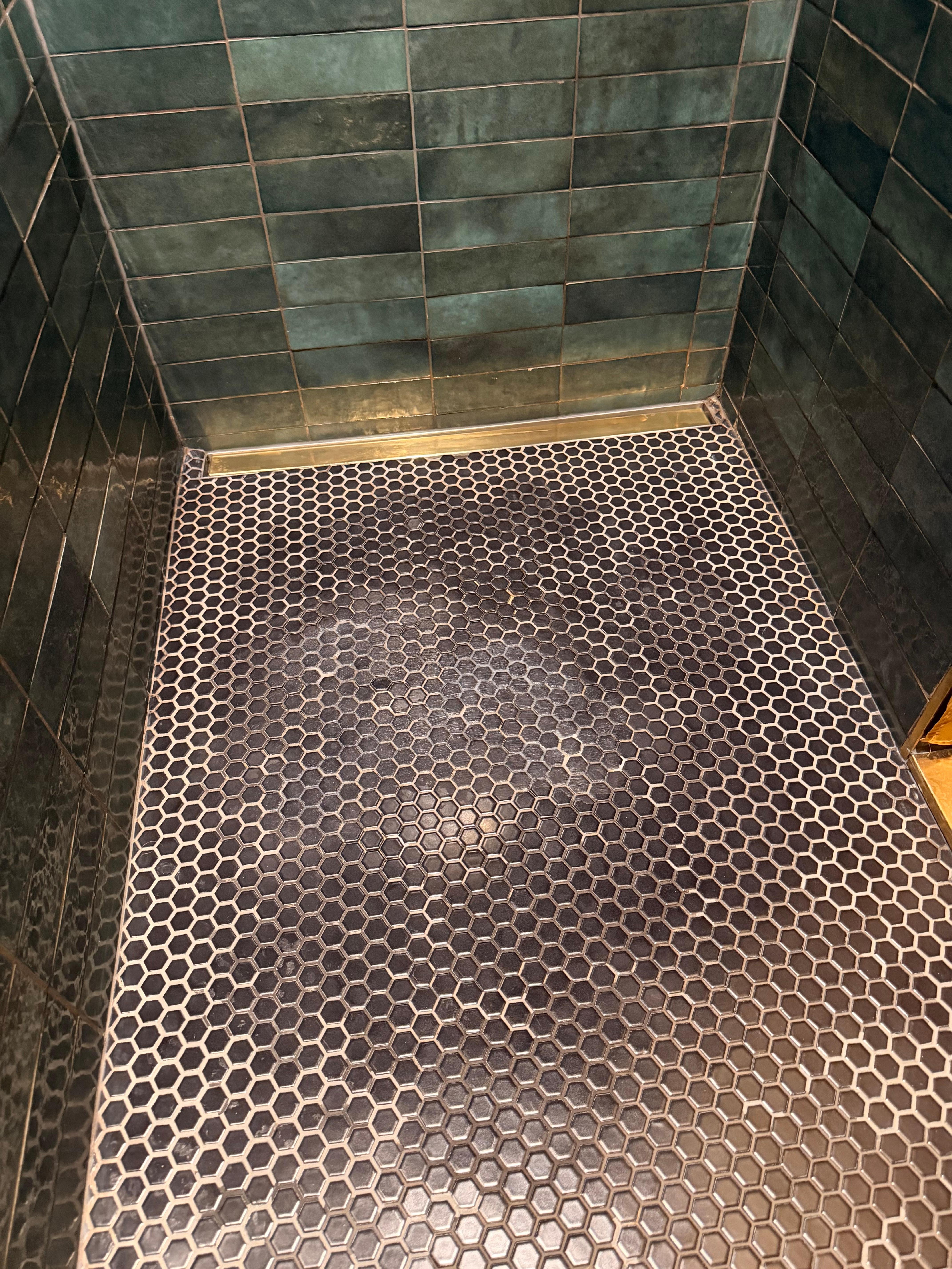 Weird resin used to try to fix shower. 