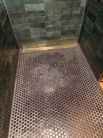 Weird resin used to try to fix shower.