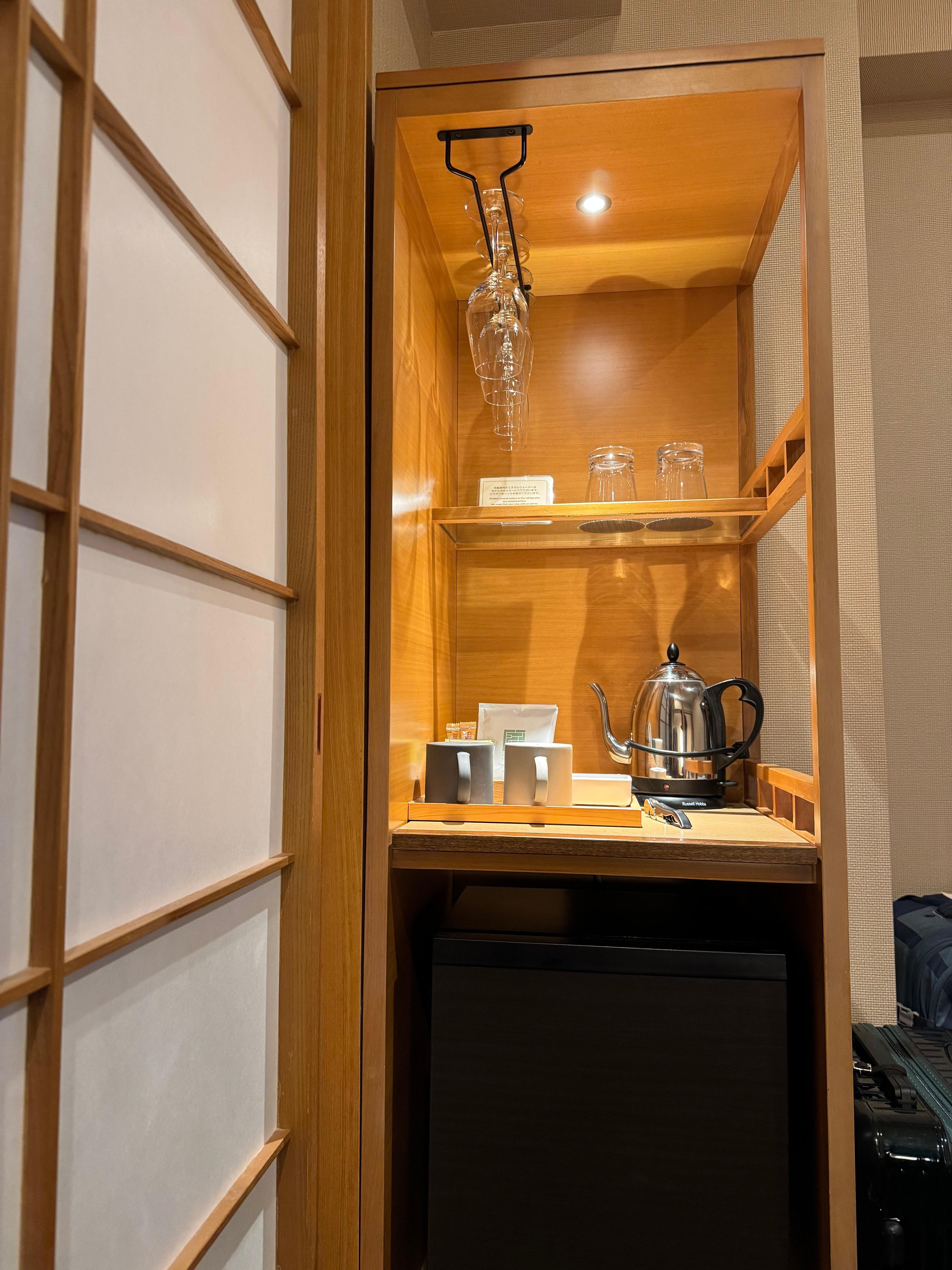 Amenities in room include water, coffee, tea, safe