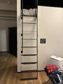 Eight rung vertical metal ladder is dangerous to use.