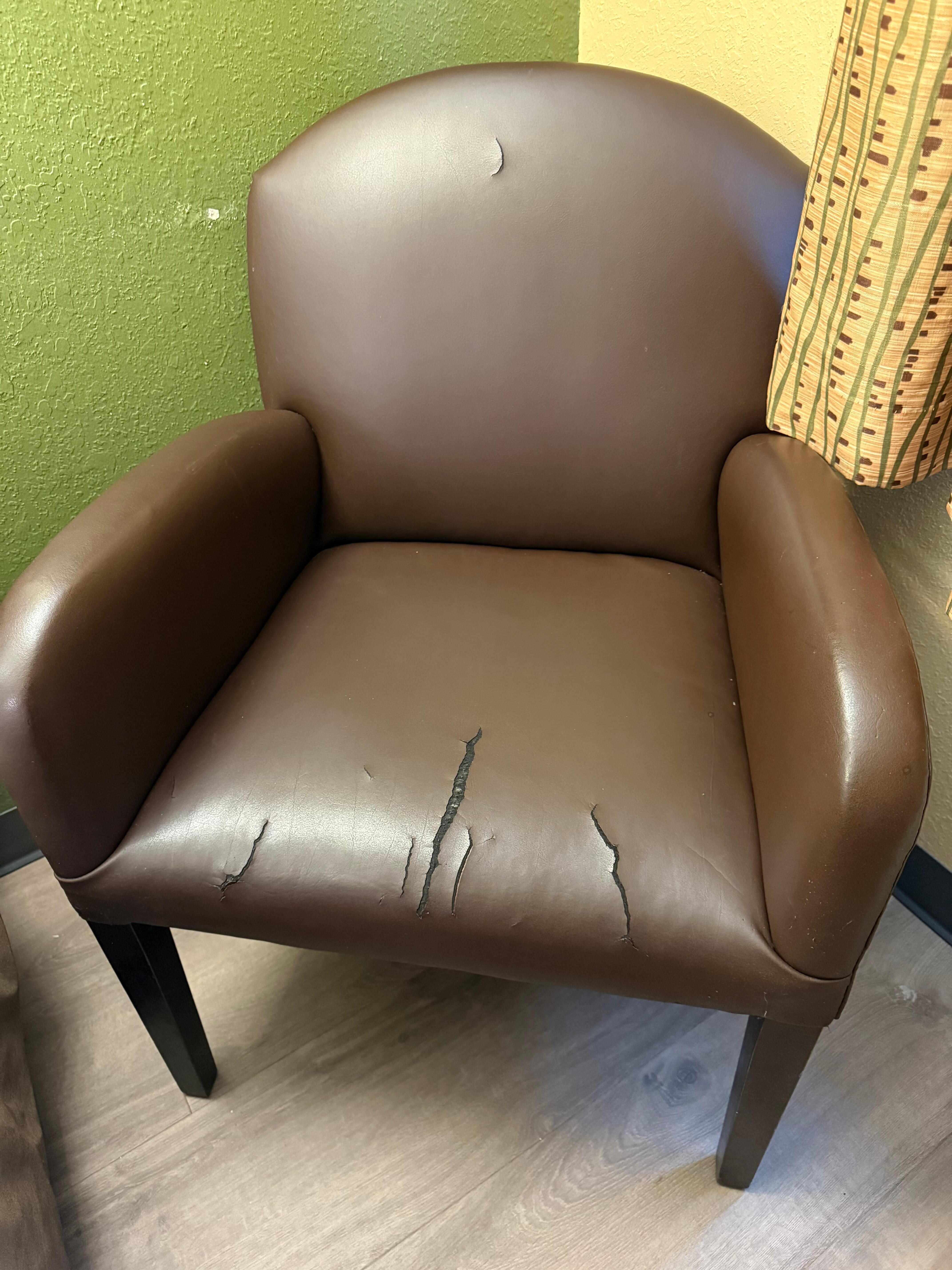 Cracked chair and Formica in the room and the tub that would not drain during the shower 