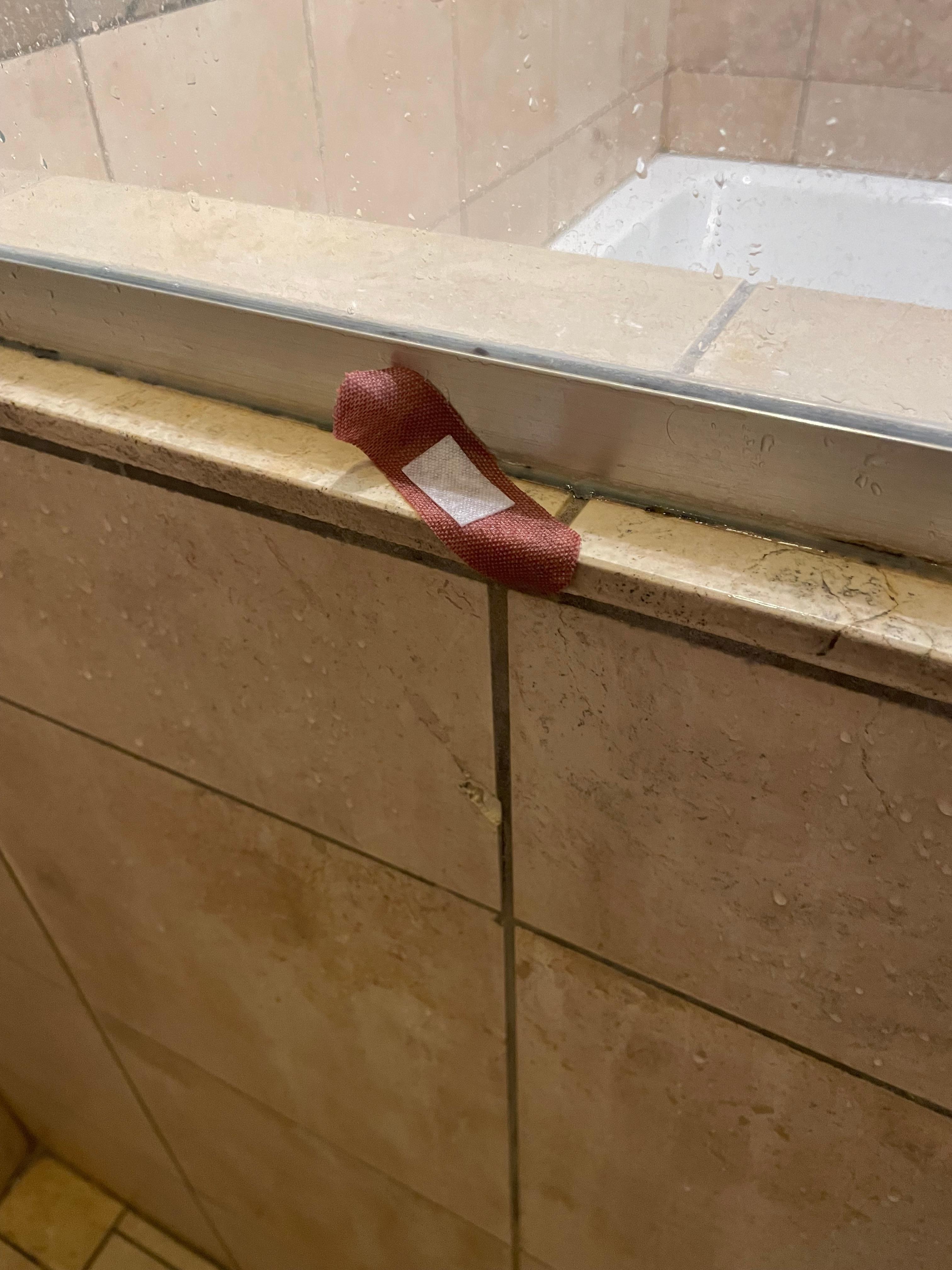 A bandage in the master bedroom shower 