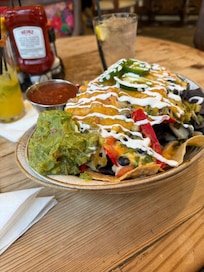 Loaded Nachos and spicy margarita on the rocks