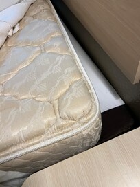 It’s at the very corner of the bed