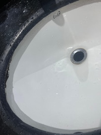 black stuff around sink and even some parts of shower