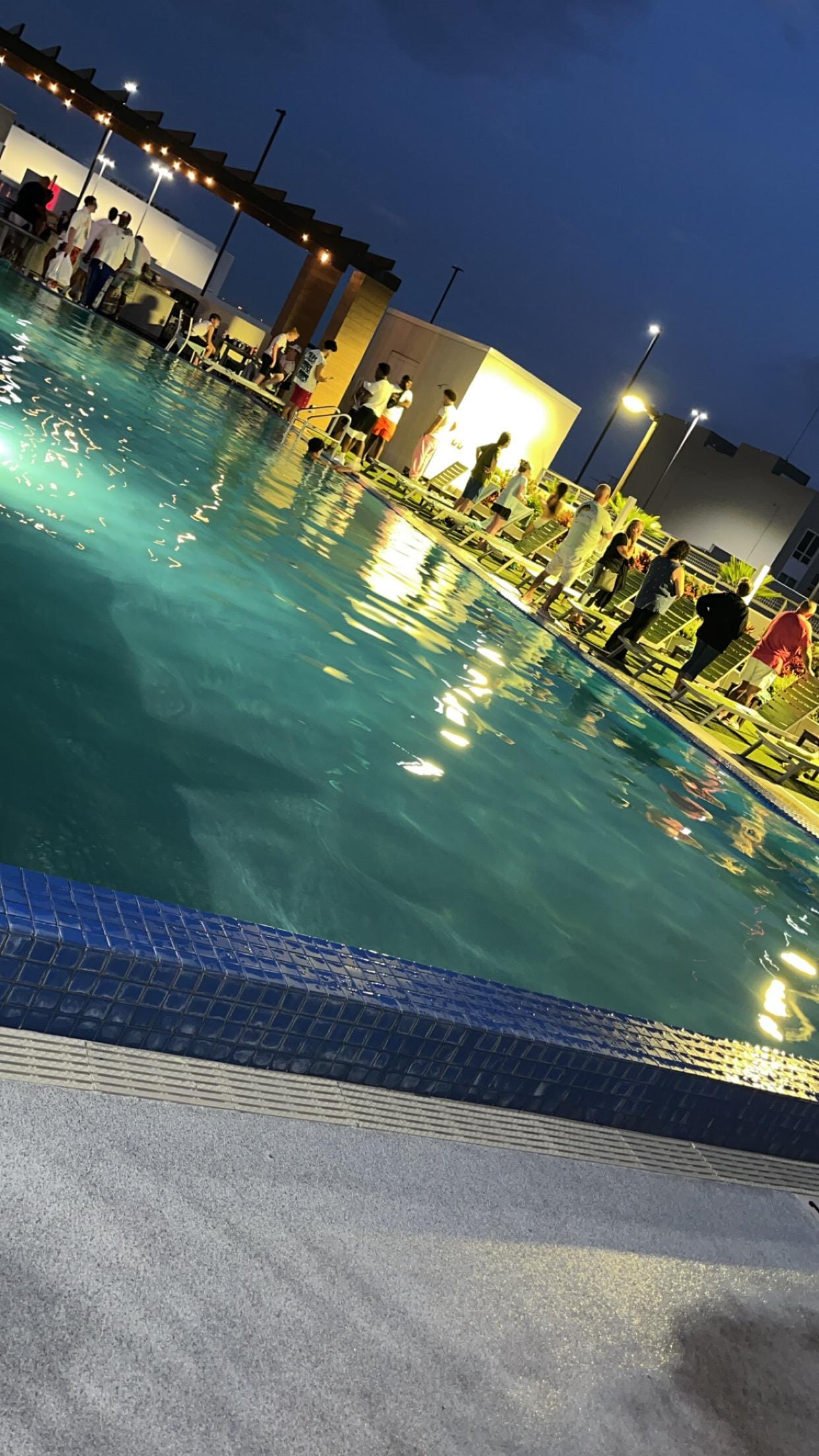 Relaxing by the pool at night.