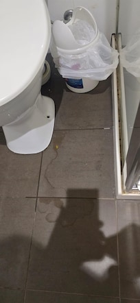 Water on floor in bathroom