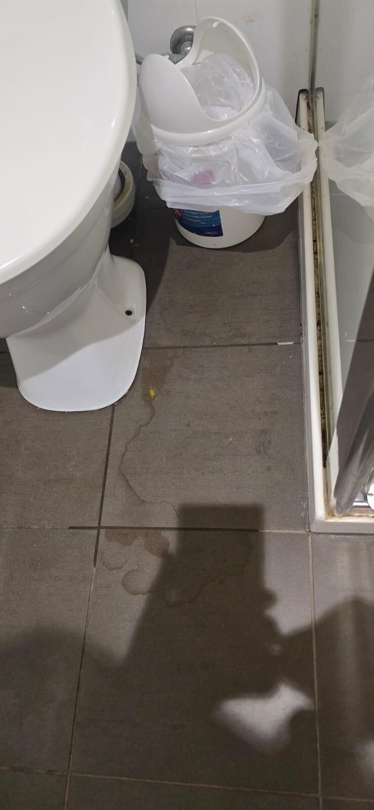 Water on floor in bathroom