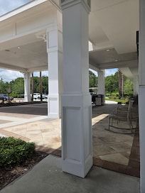 Nice front porch spot to sit, enjoy the shade and breeze
