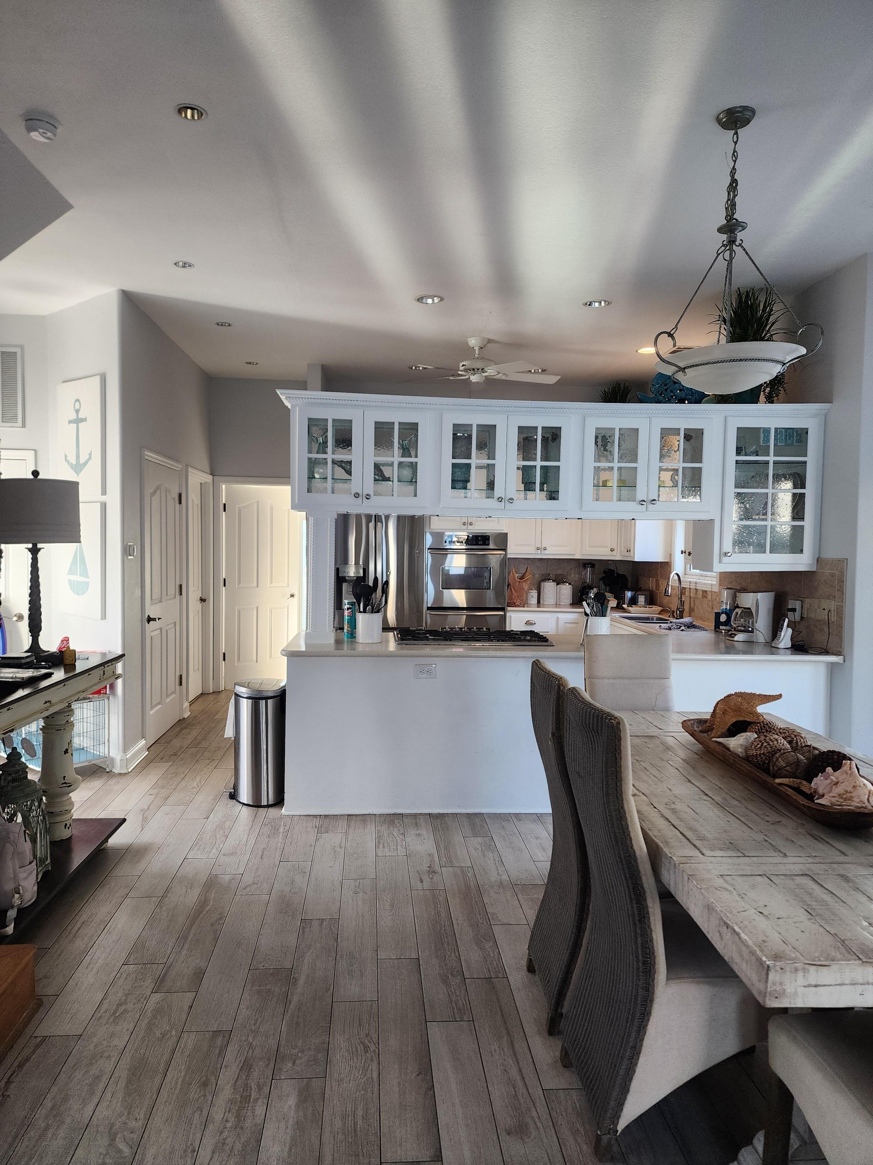 Beautiful, FULLY stocked kitchen! Pots, pans, silverware, huge refrigerator and freezer, gorgeous decor and lighting!