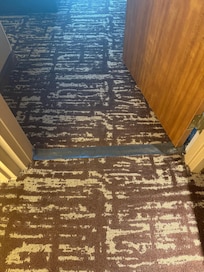 Tape to cover a hole in the carpet.