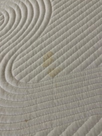 Stained pull-out mattress