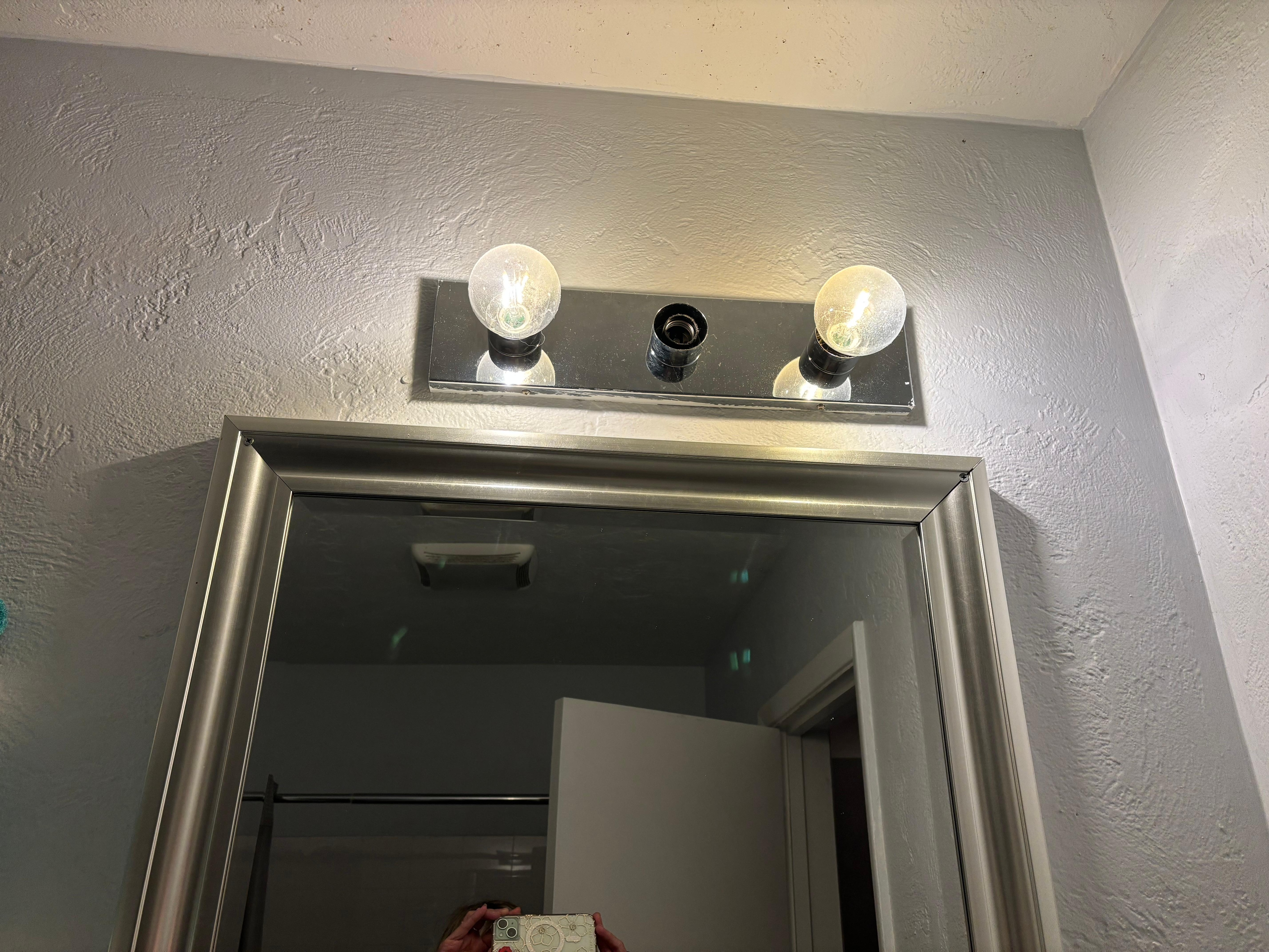 Lightbulb missing over bathroom sink