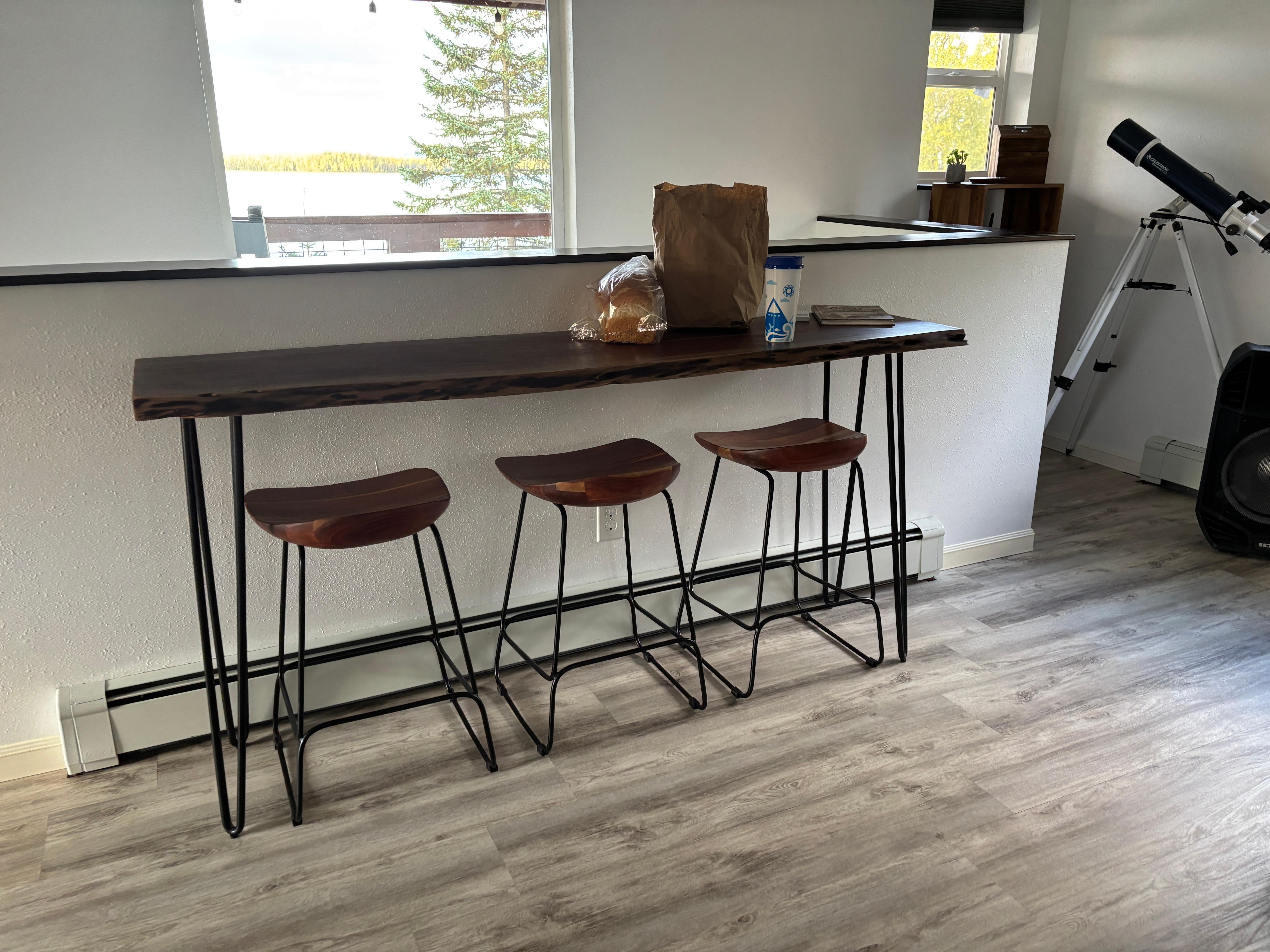 Desk area in living room overlooking lake
