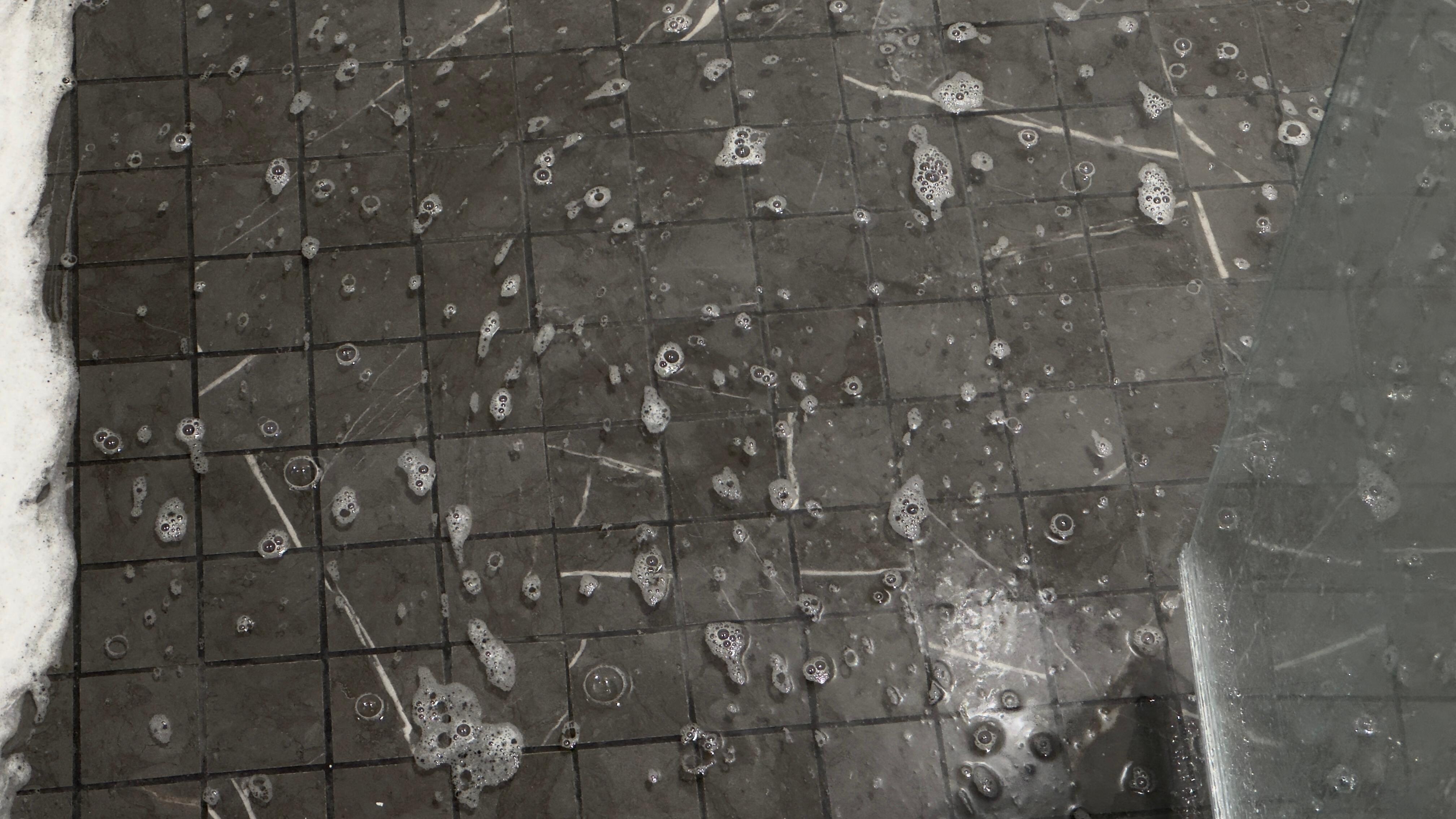 Puddle in bath shower