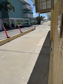 Smelly trash cans. View looking out the front door toward the access to the beach