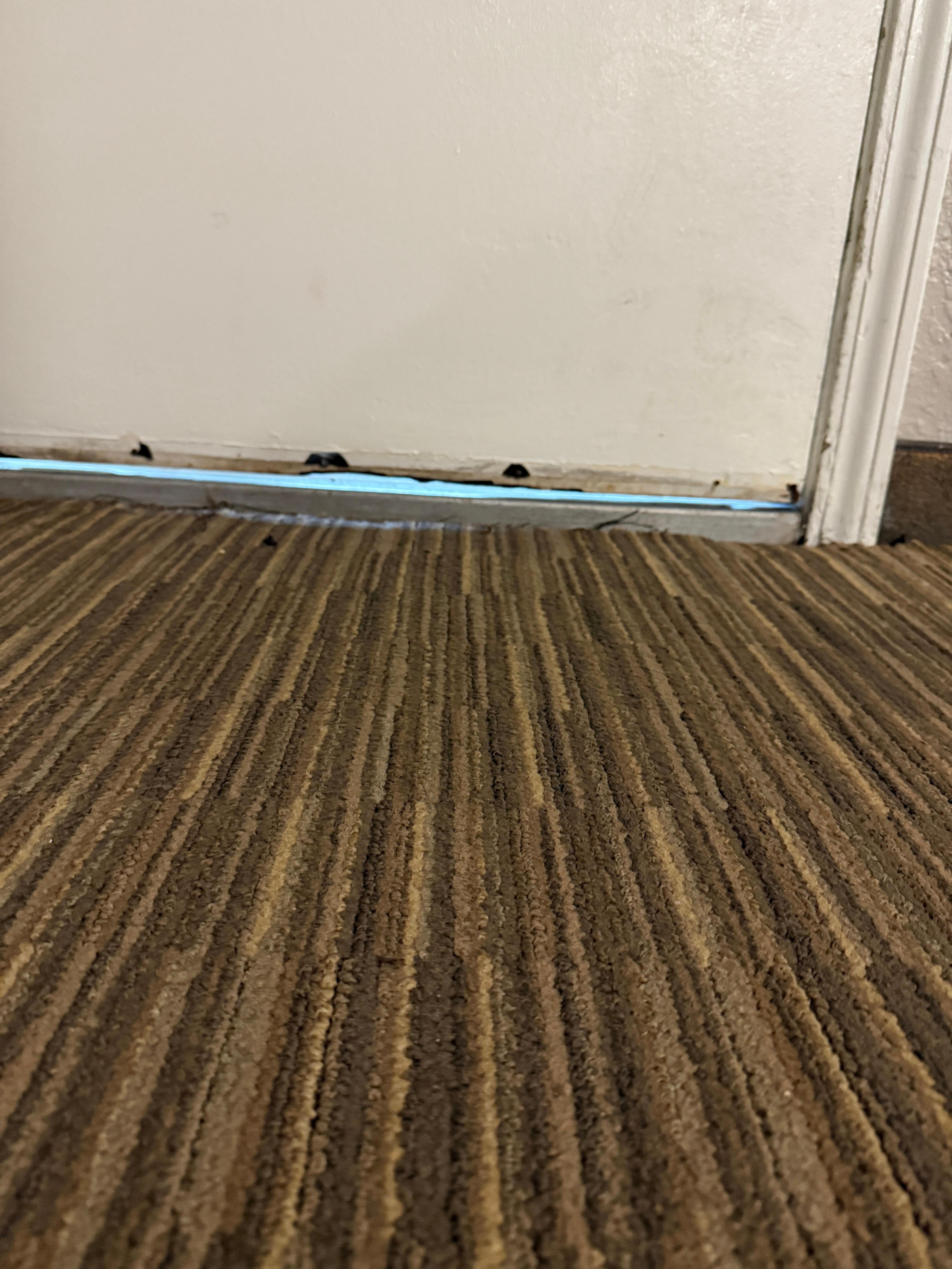 Door had no weather seal around it had call maintenance to tighten hinges on door so it would shut started rainin had to put towel in floor in front of of door to try to keep water out  didnt work towel got soaked an carpet  room was damp am musky 