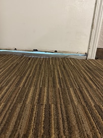 Door had no weather seal around it had call maintenance to tighten hinges on door so it would shut started rainin had to put towel in floor in front of of door to try to keep water out  didnt work towel got soaked an carpet  room was damp am musky