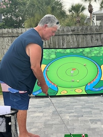 Practicing chipping on the driveway.