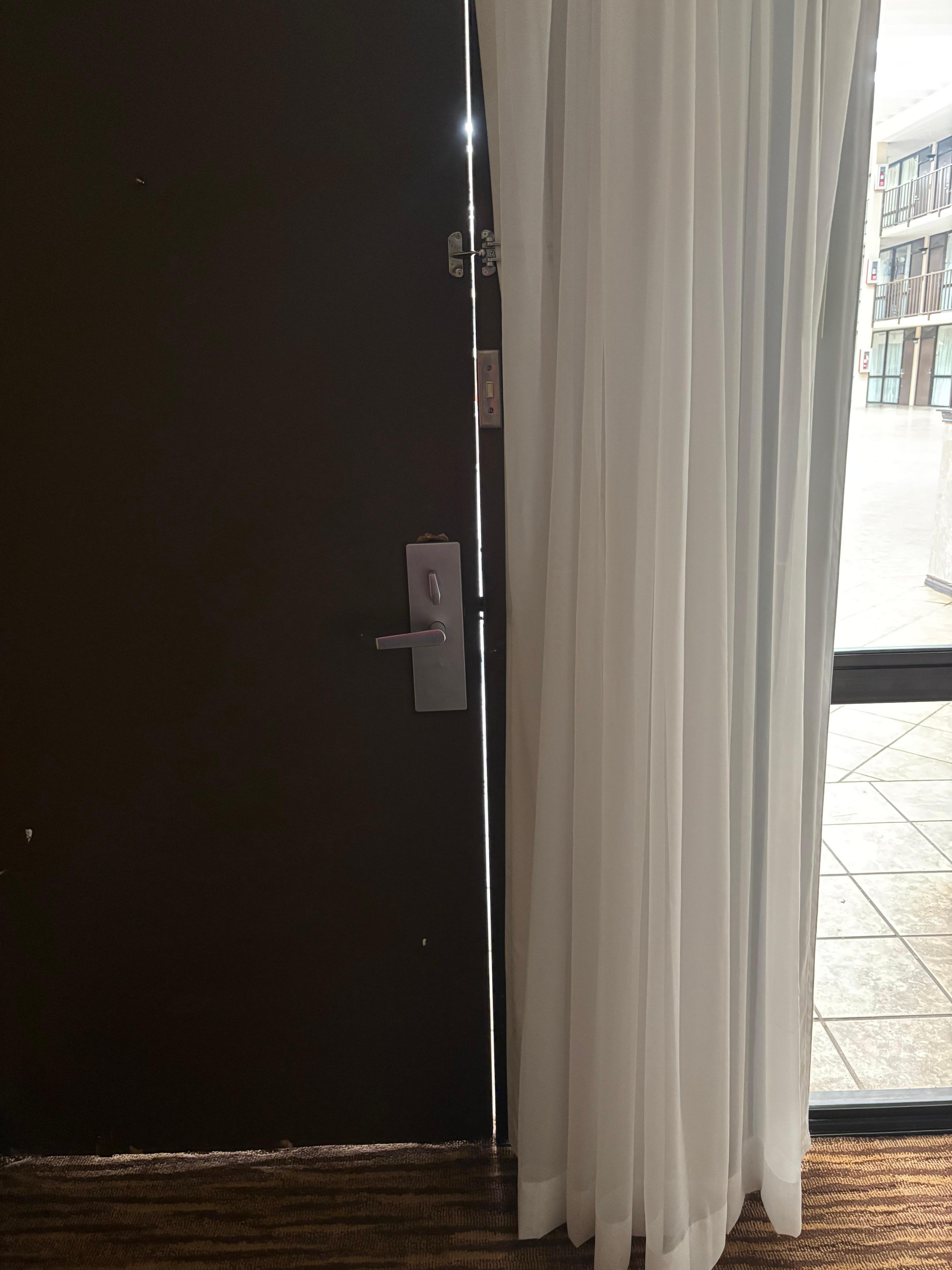 Gap in door that barely locked and looks like it has been broken into before