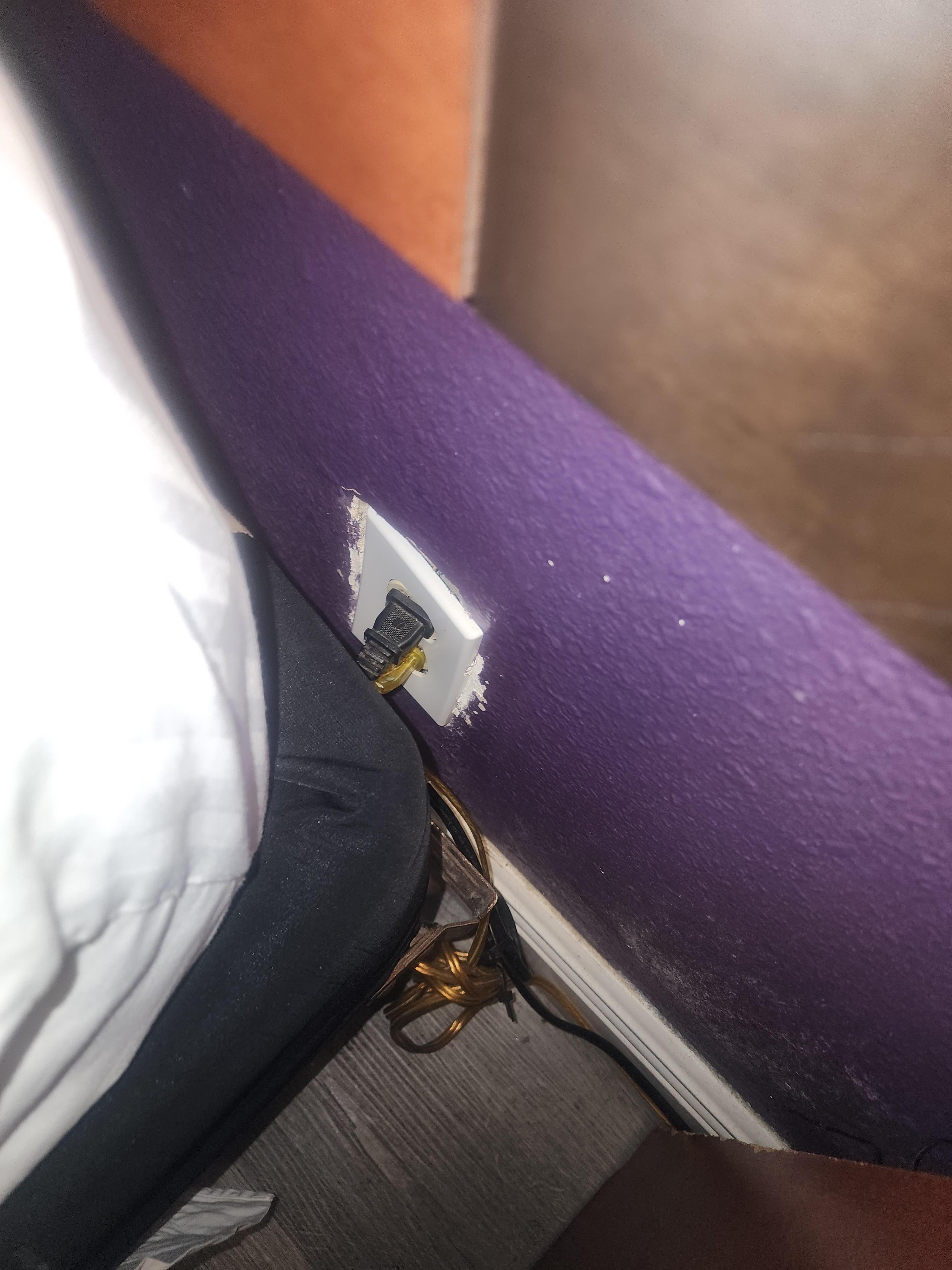 We put the wires of the socket back i to the wall it was hanging out completely