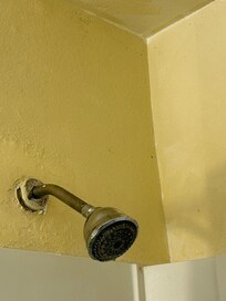 Shower coming out of wall and is moved. Didn’t run hot water.