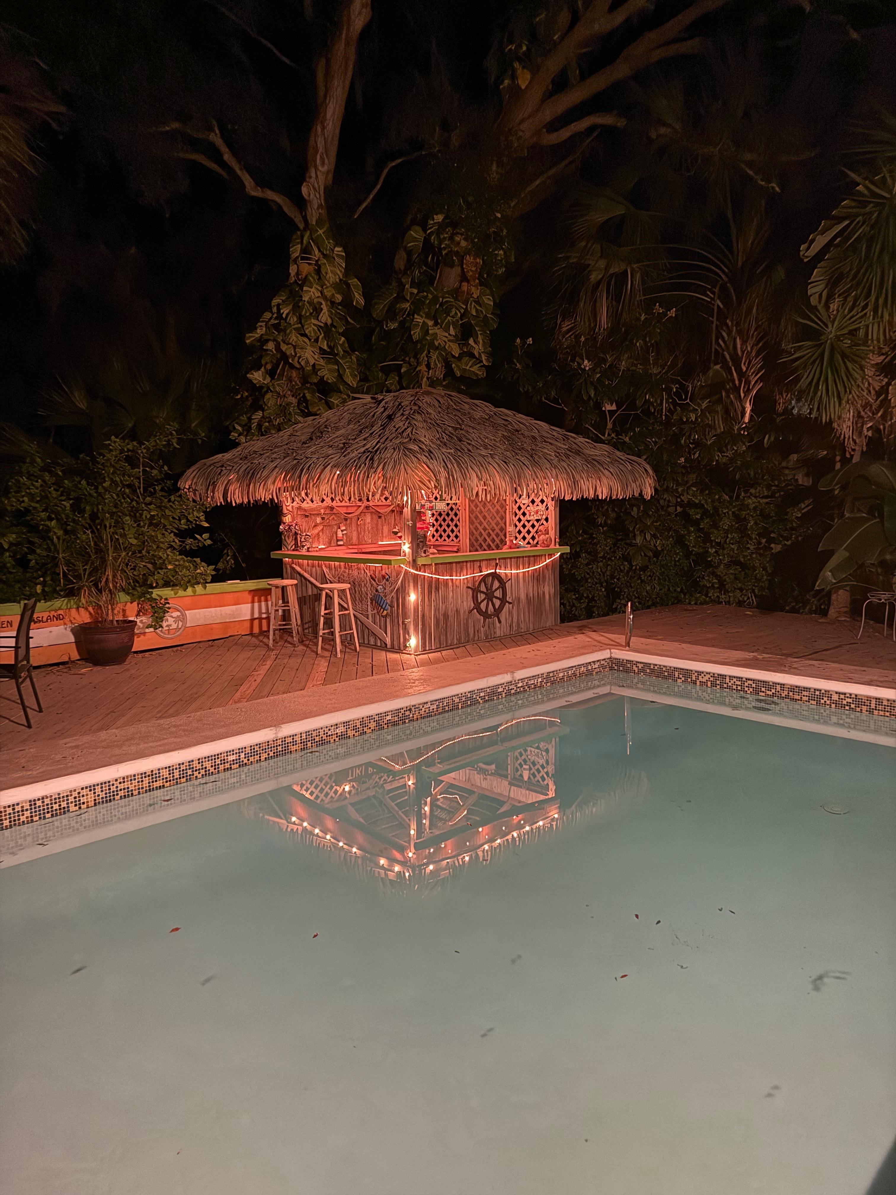 Tiki bar with small fridge inside
