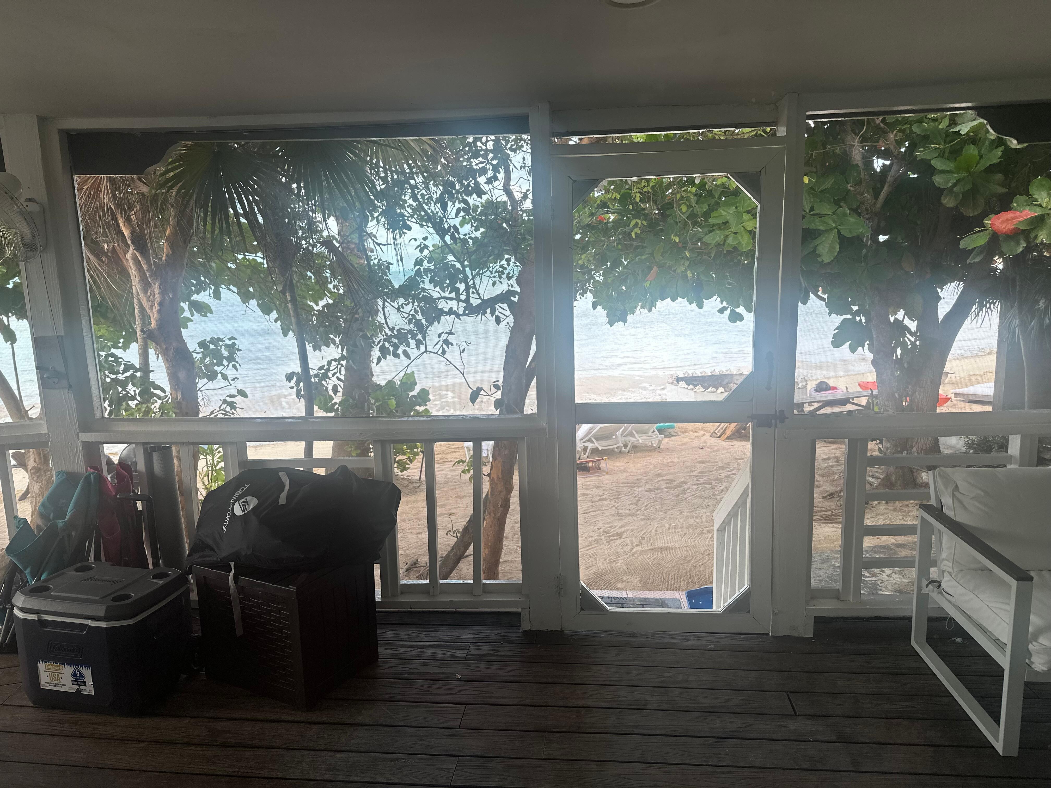 View from screened in porch looking out to the beach. 
