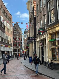 Street showing hotel sign.